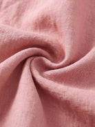 100% linen relaxed midi dress with short sleeves, large front pockets, and side slits for comfort and style