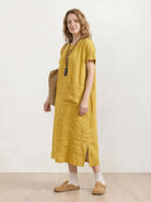 100% linen relaxed midi dress with short sleeves and large front pockets