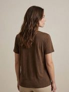 Woman wearing a breathable linen-bamboo V-neck tee with short sleeves and relaxed fit