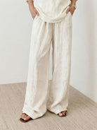 Woman wearing 100% cotton linen set with V-neck top and wide-leg pants