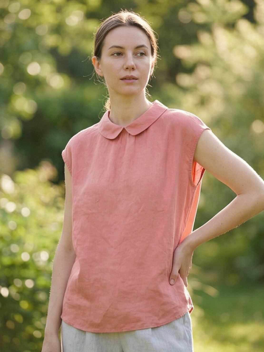 100% linen two-way button blouse with Peter Pan collar and cap sleeves on a model