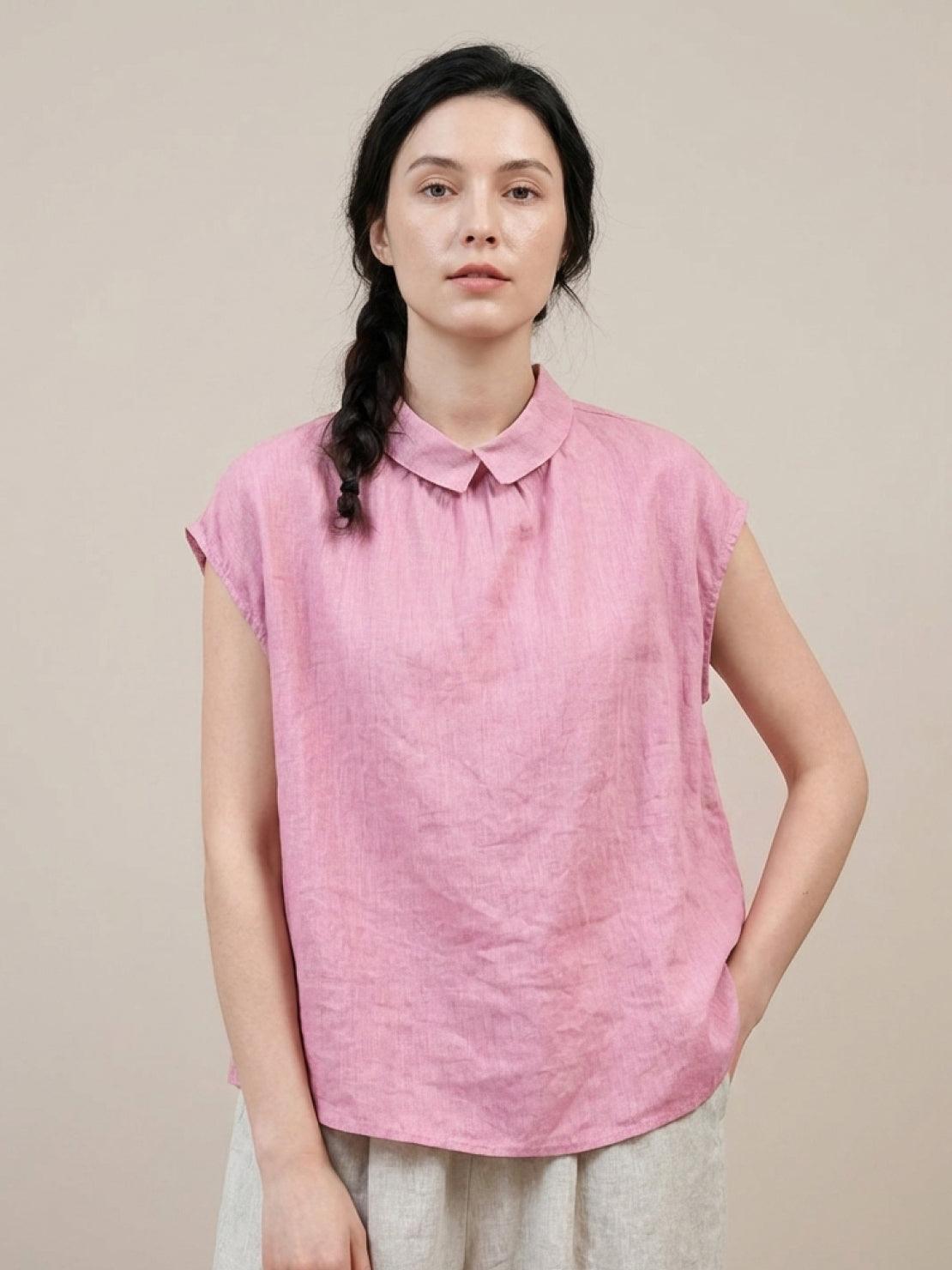 100% linen two-way button blouse with rounded Peter Pan collar and cap sleeves in relaxed A-line fit