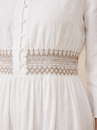 Rusty orange cotton linen dress with smocked waist and embroidered details