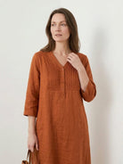Relaxed A-line cotton linen dress with pintuck pleats, 3/4 sleeves, side slits, and breathable fabric