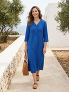 Relaxed cotton linen dress with pintuck pleats, 3/4 sleeves, side slits, and breathable fabric