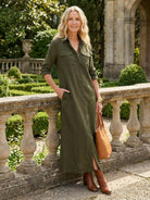 Wrinkle-free button-down maxi dress with point collar, chest pockets, long sleeves, and side slits