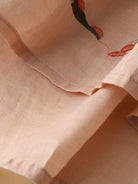 100% cotton linen hand-embroidered shirt with 3/4 flared sleeves and asymmetric hem