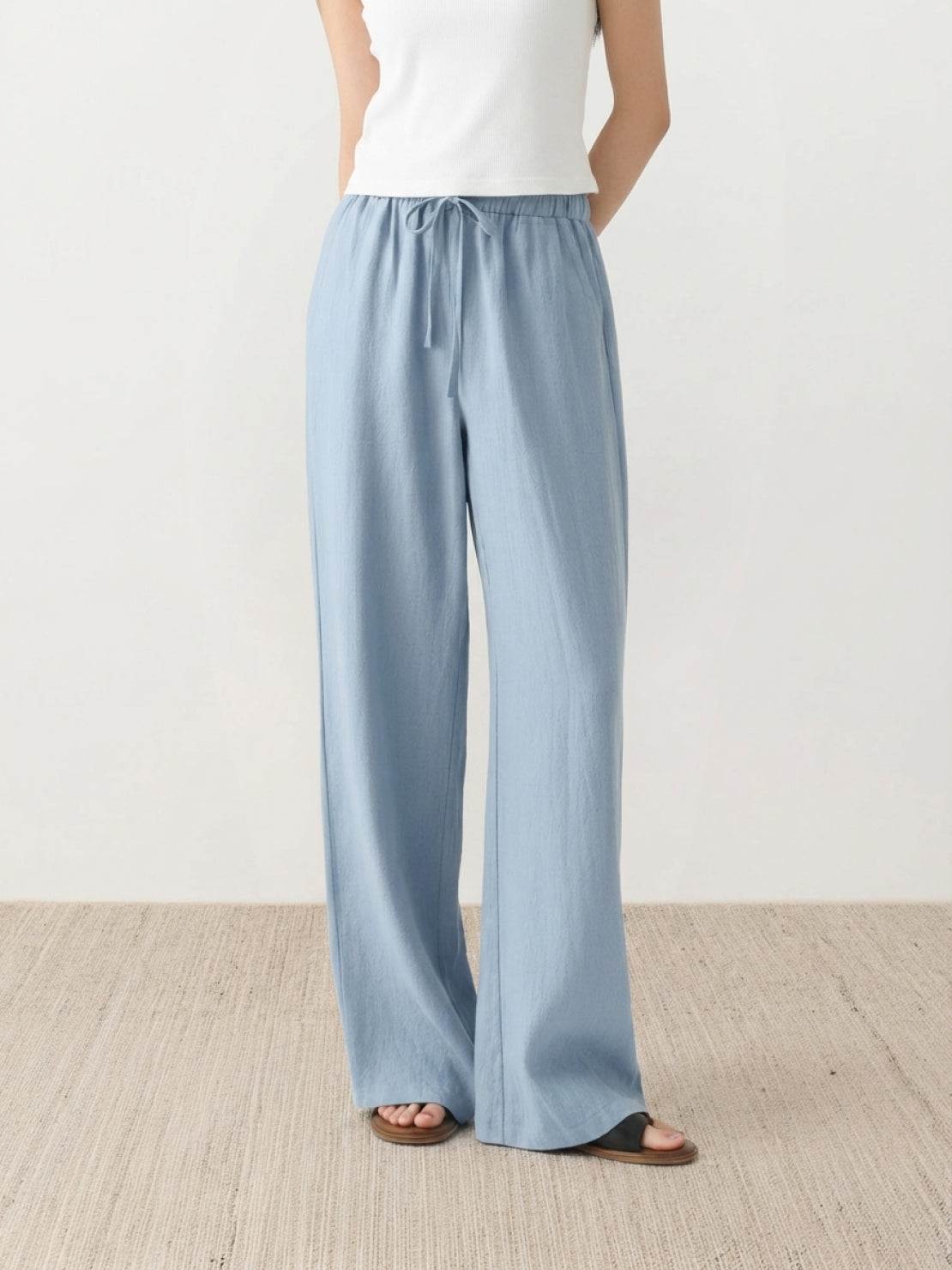 100% linen wide-leg pants with high-rise elastic waistband and side pockets