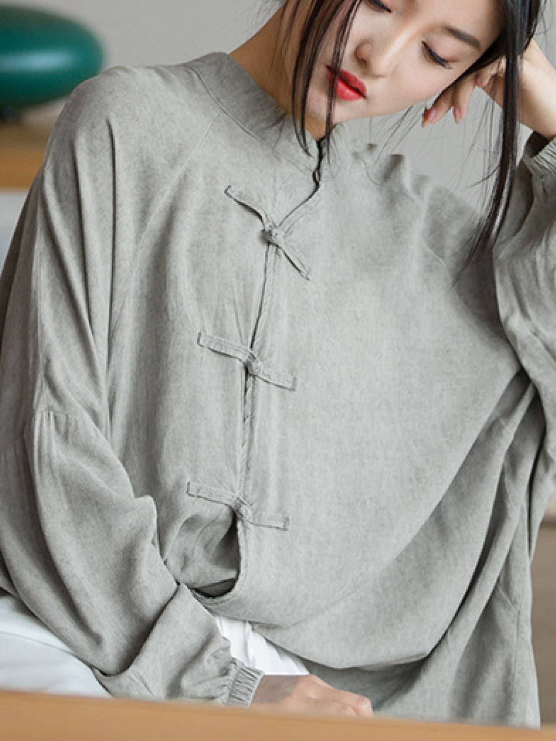 Oversized linen-cotton blouse with batwing sleeves and knotted frog button closures