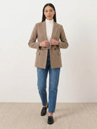 Black and white houndstooth commuter blazer with structured shoulders and relaxed fit