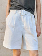 White 100% linen belted shorts with high-rise waist and relaxed wide-leg fit