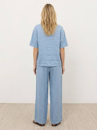 comfortable 100% cotton two-piece set with button-front top and wide-leg pants in soft solid colors