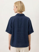 100% linen relaxed V-neck top with asymmetric button detail and short sleeves