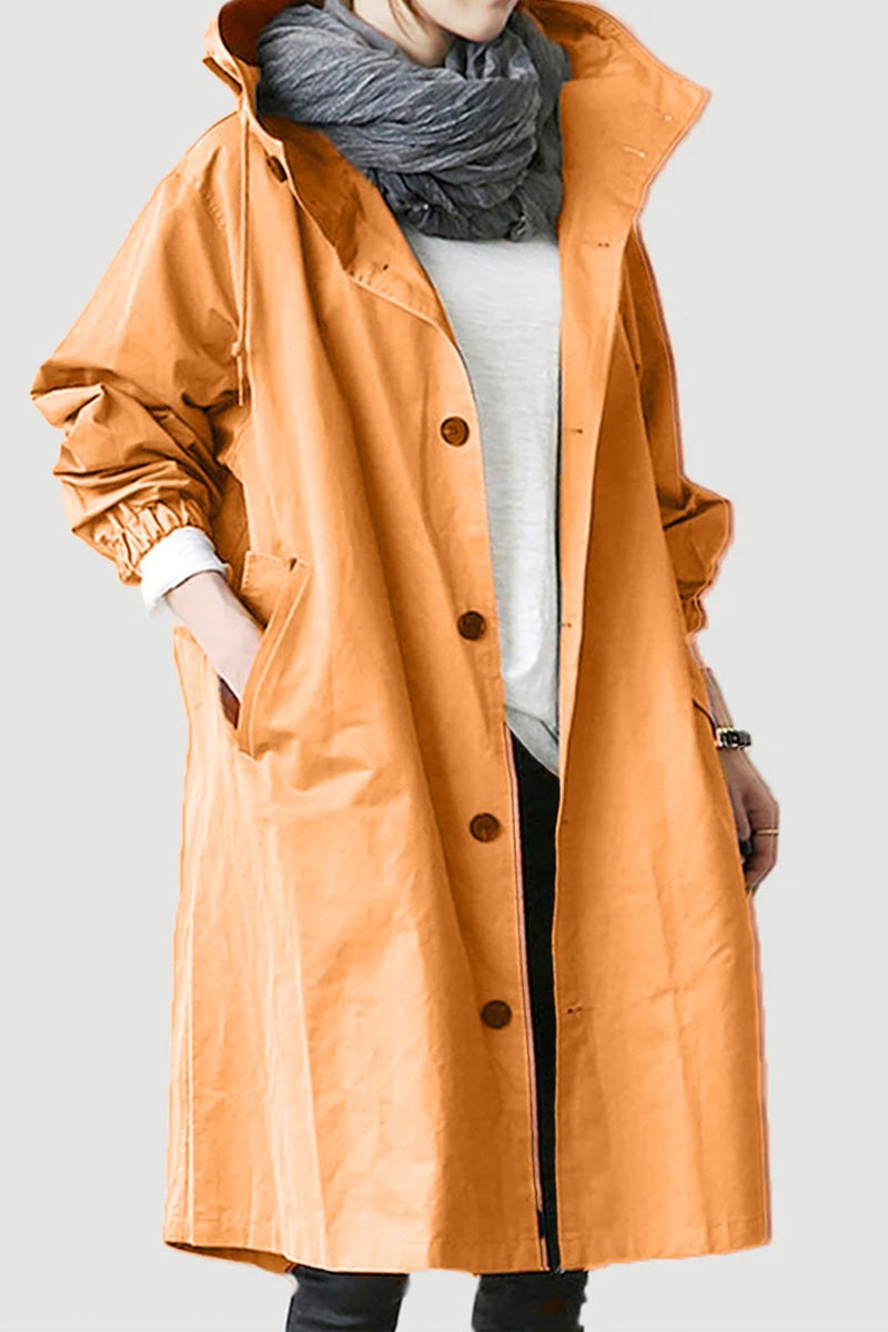 Water-resistant oversized hooded windbreaker rain jacket in orange with button closure and elastic cuffs