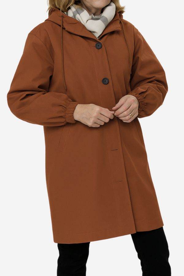 Water-resistant oversized hooded windbreaker rain jacket in brown with button closure and elastic cuffs