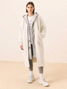 Woman wearing white oversized sherpa long coat with hoodie, casual everyday wear oversized coat for cold weather