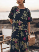 Woman wearing soft-tailored loose fit co-ord set with wide-leg cotton trousers and relaxed short-sleeve top