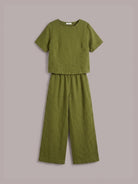 Light beige loose fit co-ord set with soft-tailored top and wide-leg bottoms made of breathable cotton.