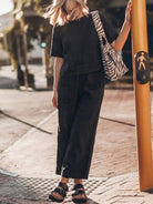 Women modeling The Meadow loose fit co-ord set with soft-tailored top and wide-leg cotton bottoms