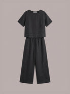 Light beige loose fit co-ord set with soft-tailored top and wide-leg cotton trousers on white background