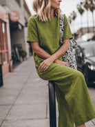 woman wearing soft-tailored, loose fit co-ord set with wide short sleeves and wide-leg trousers