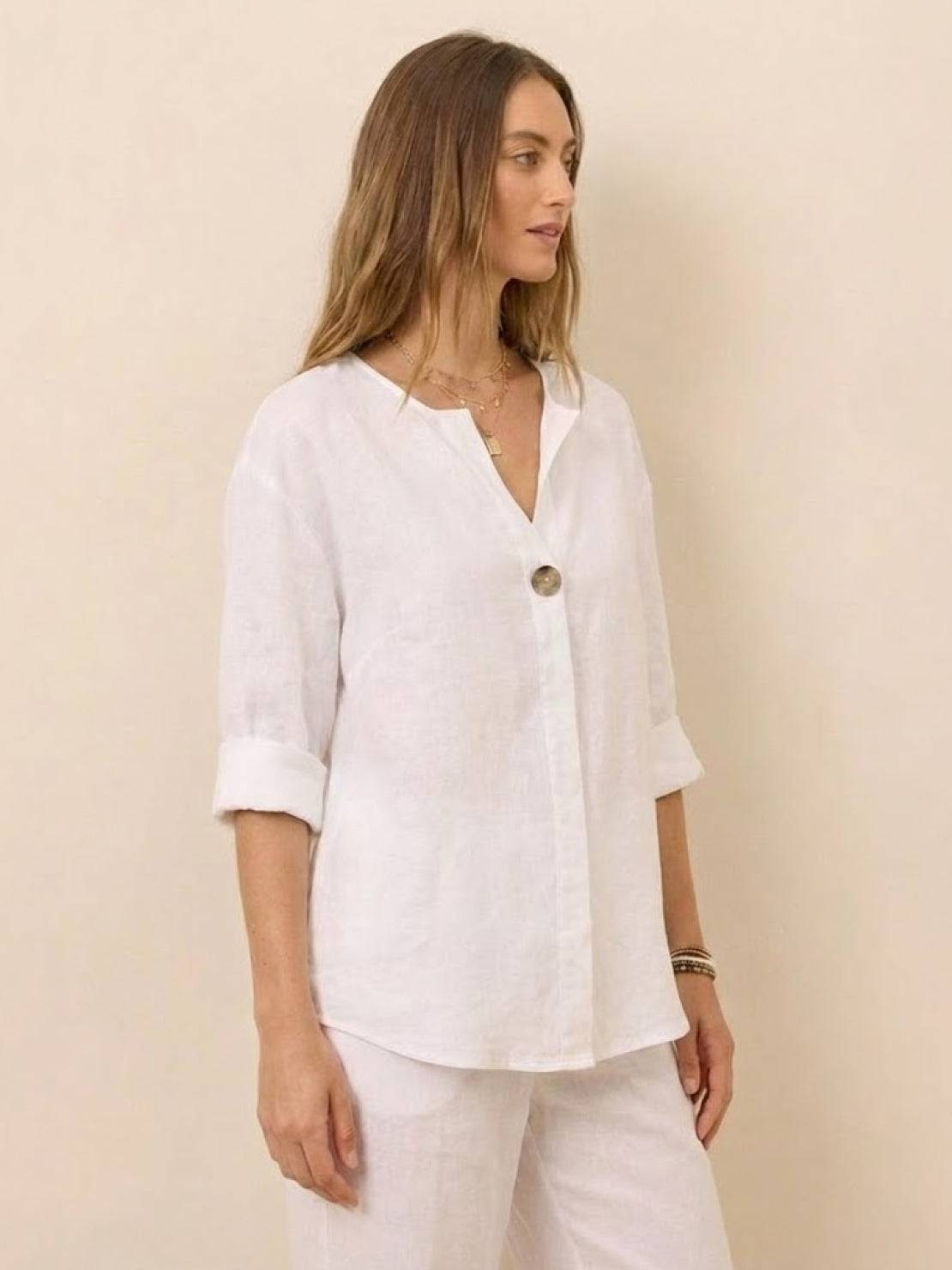 White pure linen age-defying shirt with button detail, relaxed fit, and breathable fabric for women