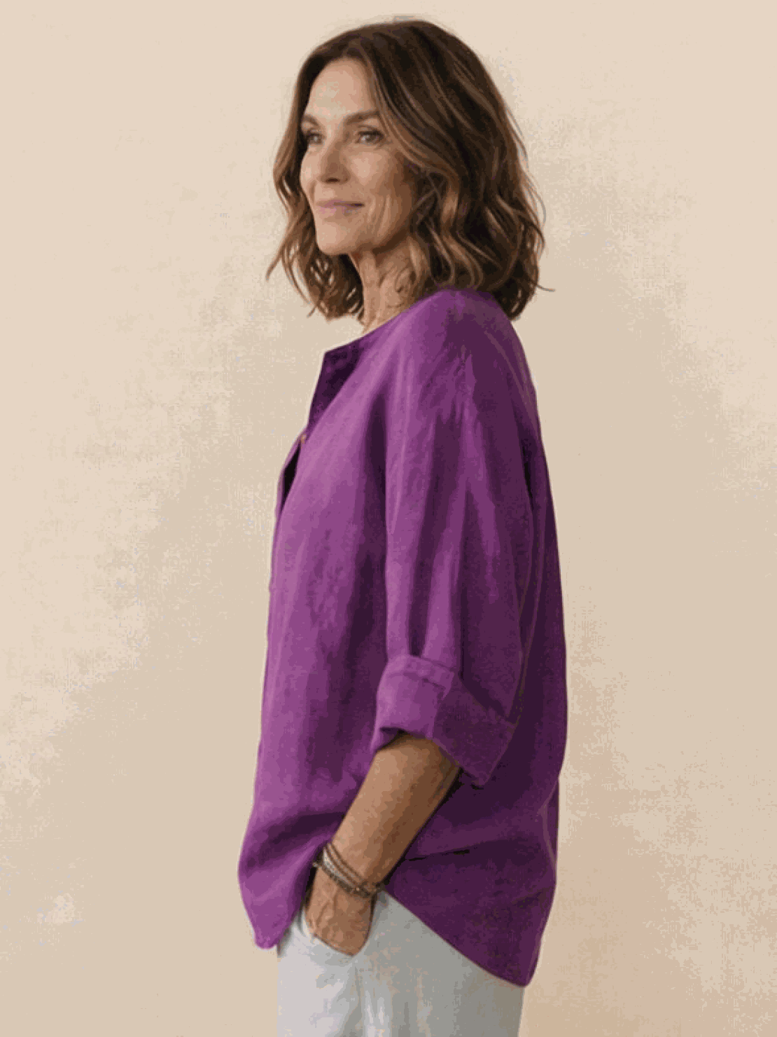 White pure linen age-defying shirt with elegant button detail on wooden background