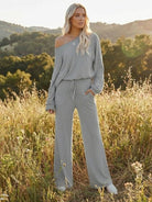 woman wearing gray round neck loose fit cozy two-piece set with wide-leg pants outdoors in field