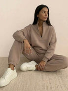 Cotton-blended two-piece tracksuit with high collar and deep zipper in cozy, durable athleisure style