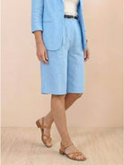 Polished woman wearing a blazer and high-waisted shorts two-piece set