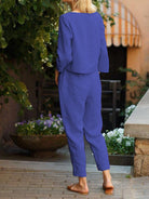 Woman wearing cotton-linen monochrome relaxed longline top and wide-leg pants set