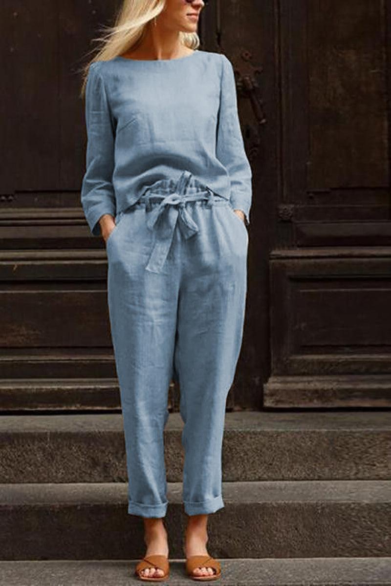 Woman wearing a blue cotton-linen monochrome longline top and wide-leg pants set with a relaxed fit and tied waist