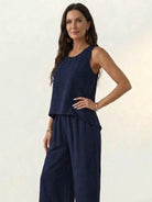 Woman wearing Dreamcatcher Crochet-Back sleeveless top with crochet mandala back and wide-leg palazzo pants set