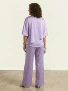 Elegant Layers two-piece set with layered V-neck top and matching pants in soft polyester fabric