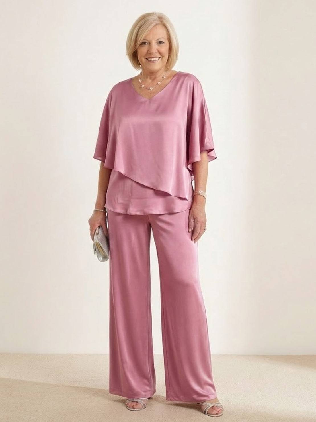Woman wearing Elegant Layers Two-Piece Set with layered V-neck top and comfortable pants