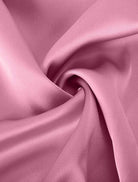 Woman wearing elegant layers two-piece set with layered V-neck top and matching pants in soft fabric