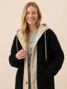 Woman wearing everyday wear oversized sherpa long coat with cozy lining and relaxed fit