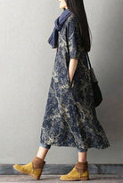 Loose fit Japanese Porcelain Print midi dress in blue with 3/4 sleeves and oversized pockets, made of 100% cotton.