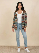 Highland Plaid Shacket with hood, soft fleece lining, button front, and front pockets in classic plaid pattern.