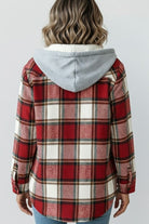 Back view of woman wearing Highland Plaid Shacket with red plaid pattern and attached gray hood