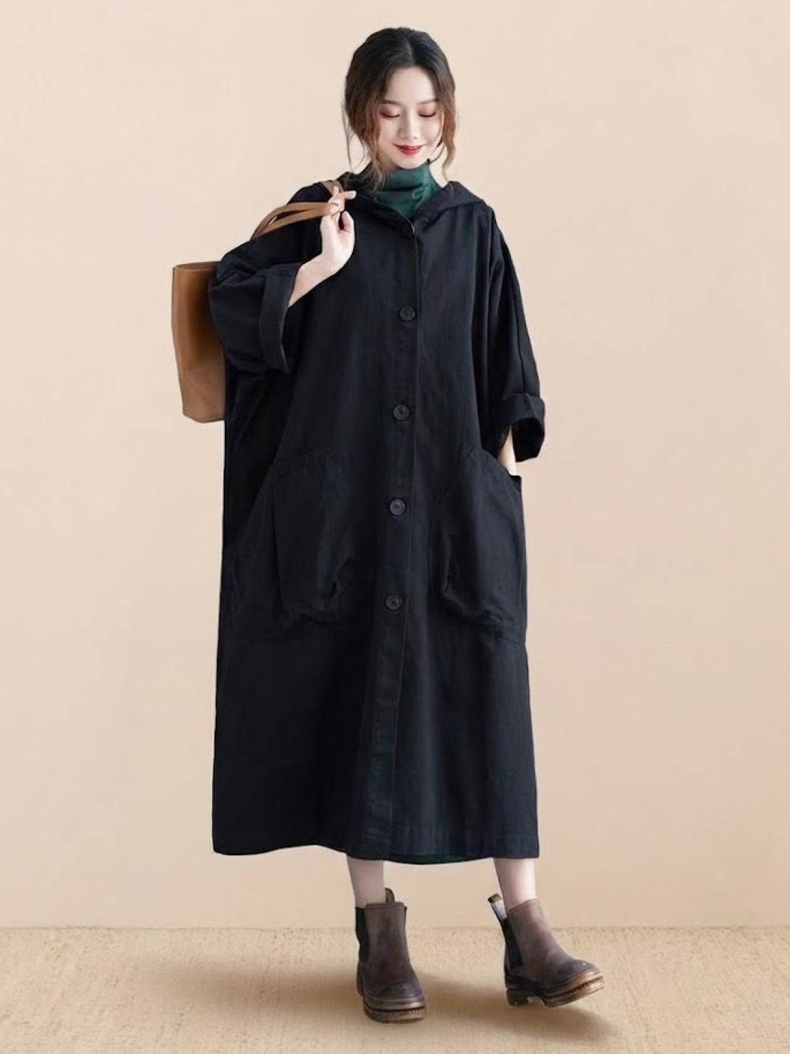 One size fits all oversized black water-resistant windbreaker jacket with waterproof design and attached hood