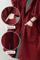 Oversized water resistant windbreaker jacket in deep red with large front pockets and attached hood for stylish, practical layering