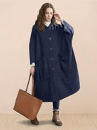 Oversized navy water-resistant windbreaker jacket with waterproof design and large front pockets