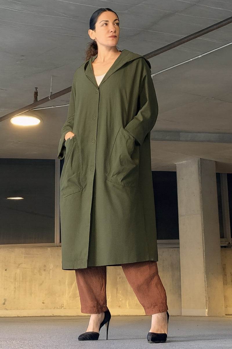 Oversized heritage windbreaker jacket in olive green with hood and large front pockets for women