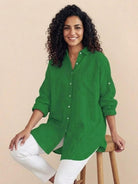 Oversized linen shirt in white with relaxed fit and back button details