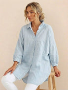 Oversized linen shirt with relaxed fit and back button detailing in breathable cotton-linen blend