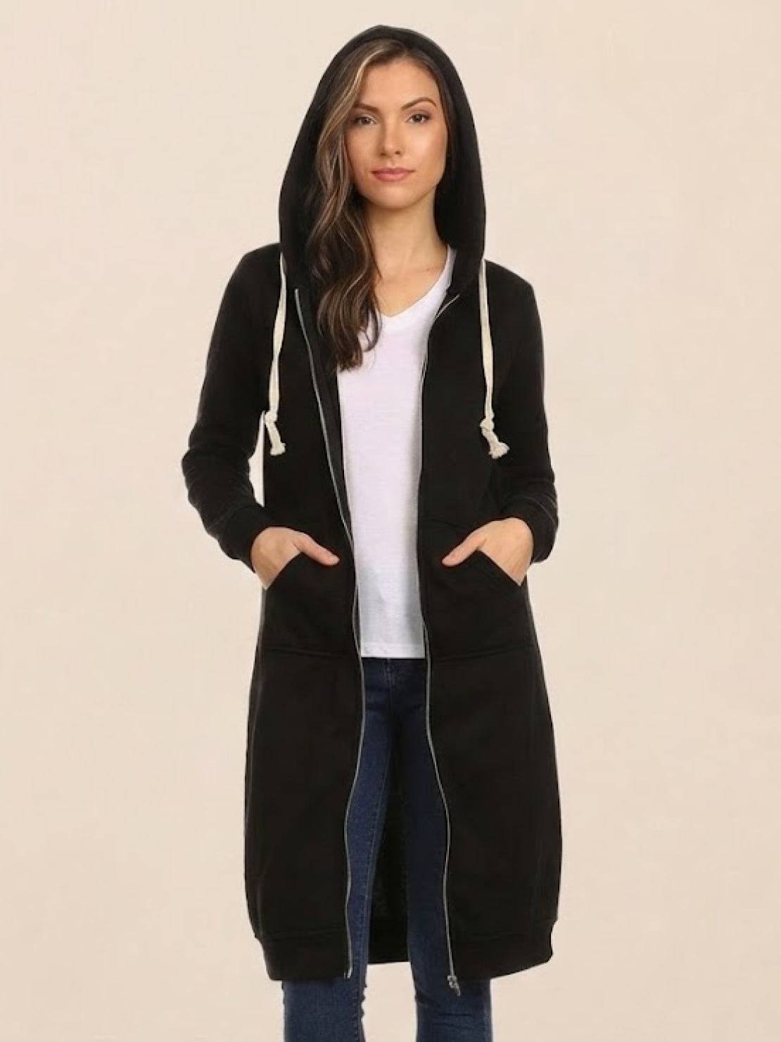 Woman wearing black oversized long zip sweatshirt hoodie with hood and front pockets