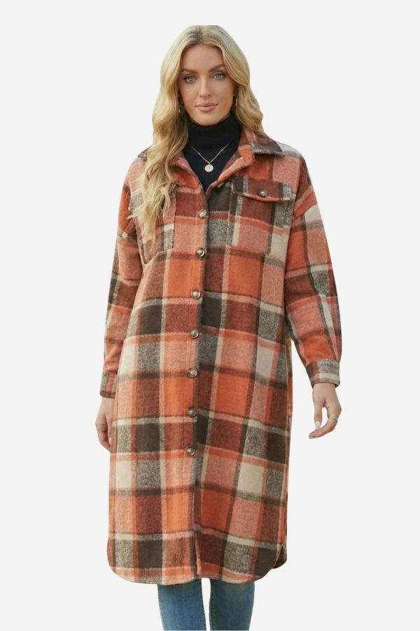 Oversized long orange and brown plaid shirt jacket with button front and pockets worn by woman