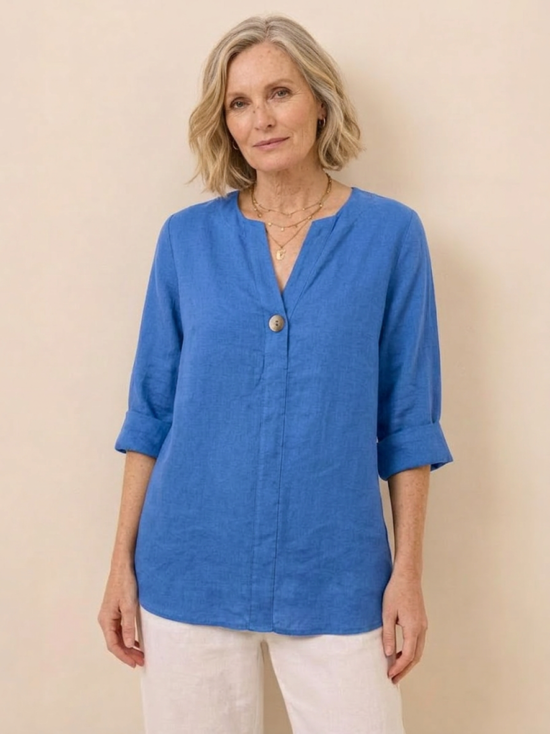 white pure linen age-defying shirt with button detail on hanger