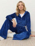 Modern cropped velour tracksuit set with high-waist pants and plush texture